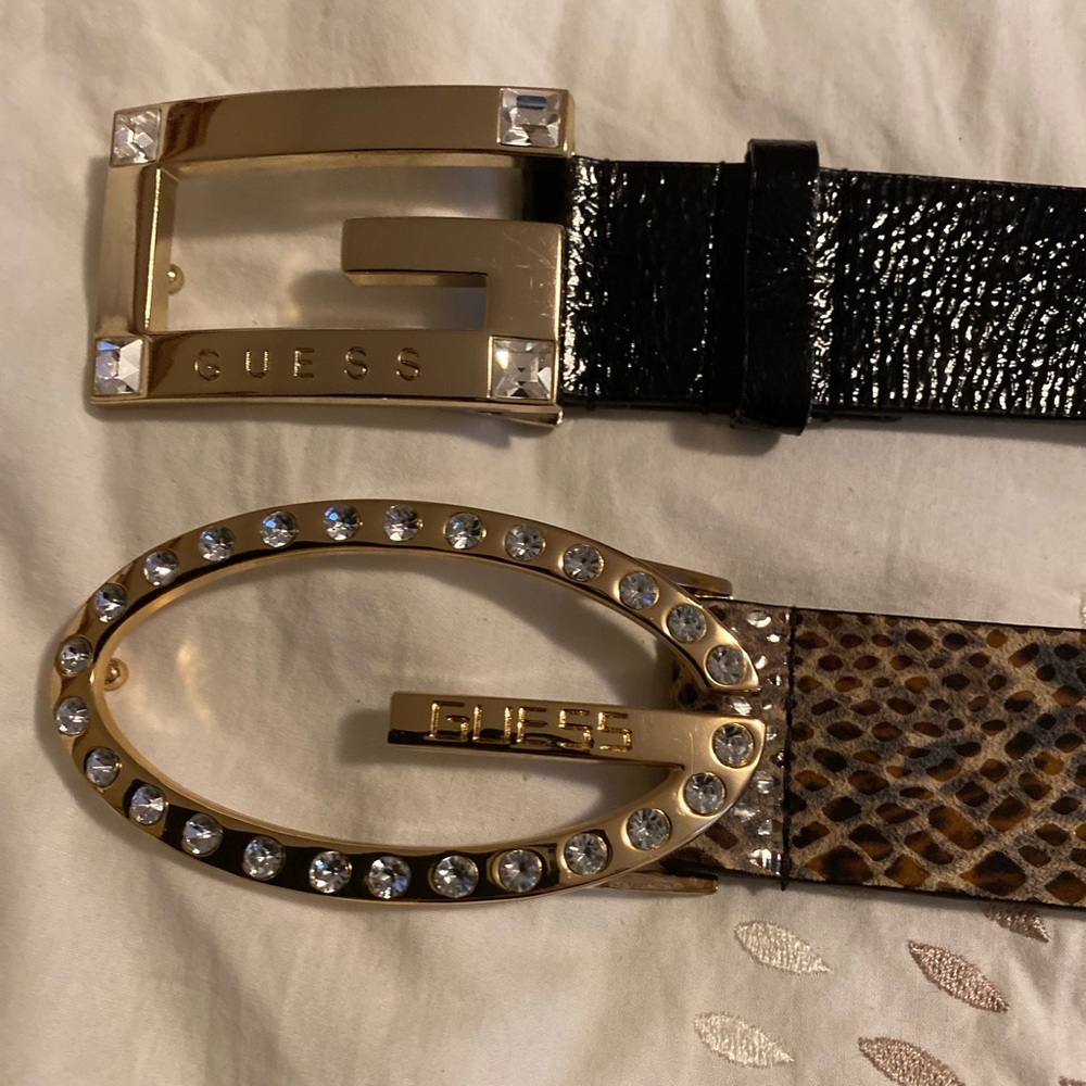 2 Guess belts. Stylish Guess belts.  1 black, 1 snakeskin